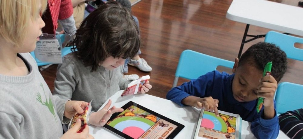 Image courtesy of supplier // Students working with Joko’s World interactive learning apps.
